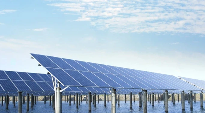 Solar panels installed over water.